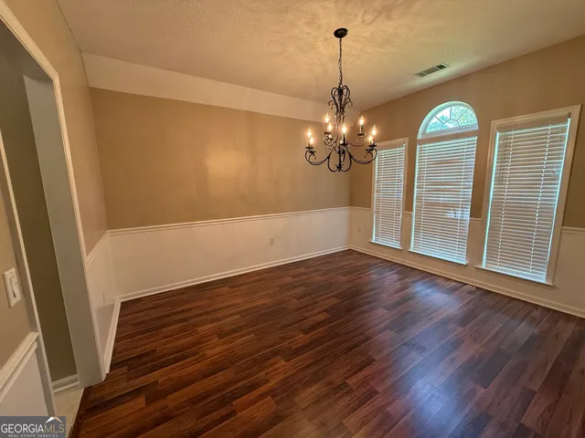 a view of a livingroom with wooden floor
