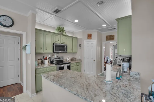 a kitchen with a refrigerator and a sink