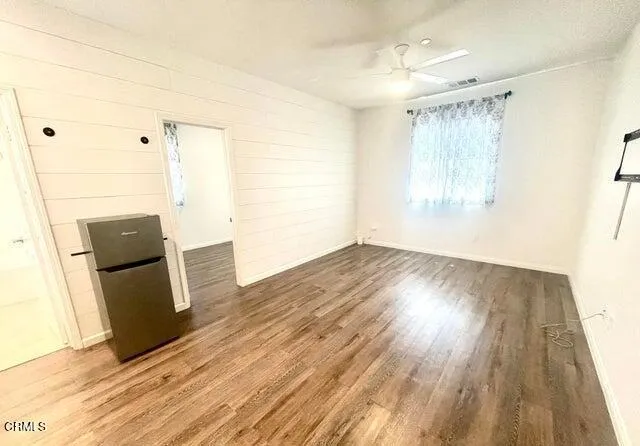 a view of a storage & utility room with wooden floor