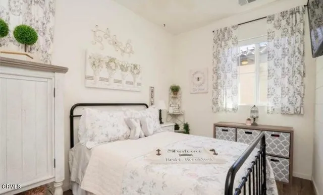 a bedroom with a bed and a table