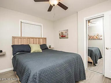 1339 Flatwood Road Sevierville, TN 37862 - Photo 20 of 26 a bedroom with a bed and a painting on the wall