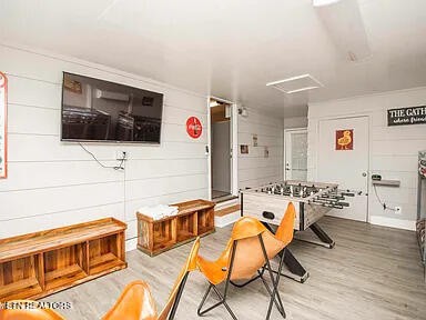 1339 Flatwood Road Sevierville, TN 37862 - Photo 25 of 26 a living room with furniture and a flat screen tv