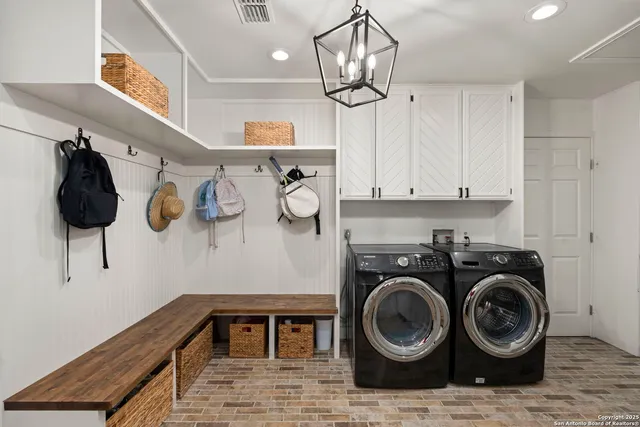 a living room with fireplace furniture and a wooden floor