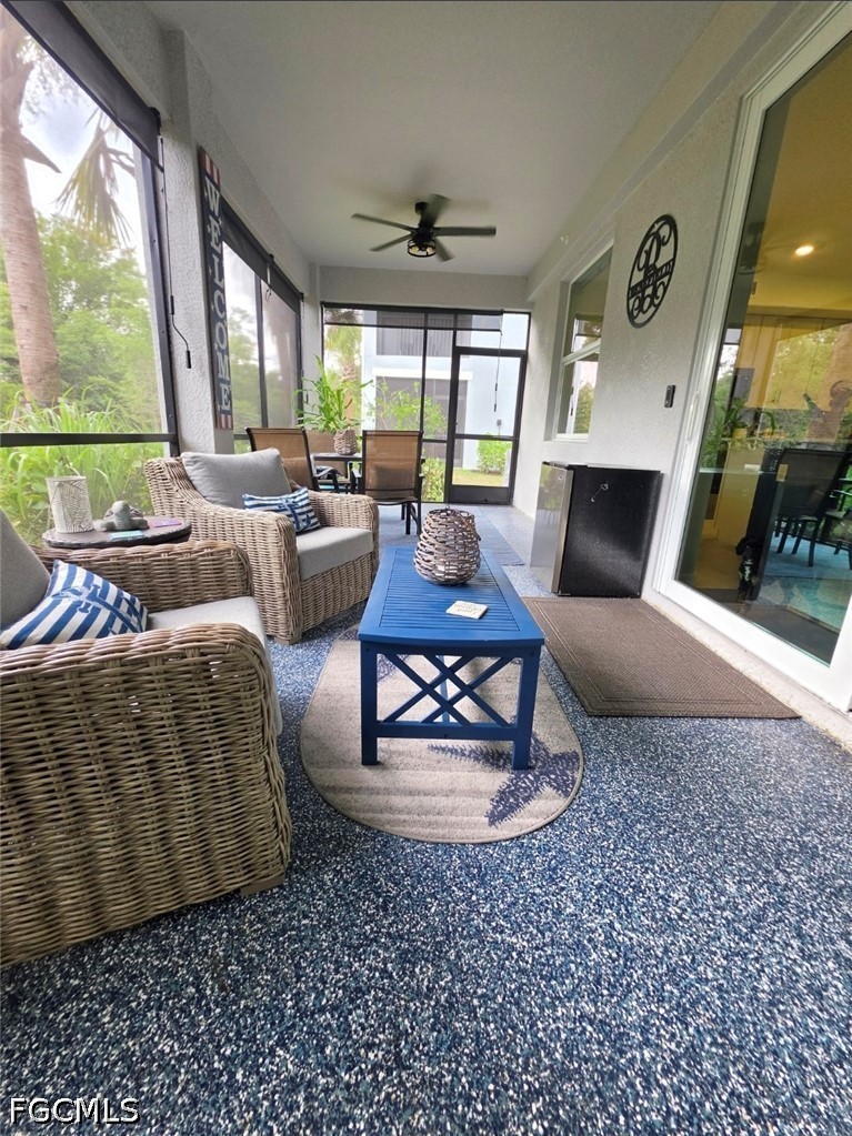 14191 Poppy Fld Loop, Unit 5312 Punta Gorda, FL 33955 - Photo 25 of 41 a living room with furniture and a large window