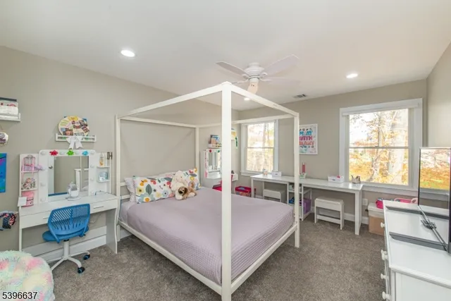 a bedroom with a bed and a table in it