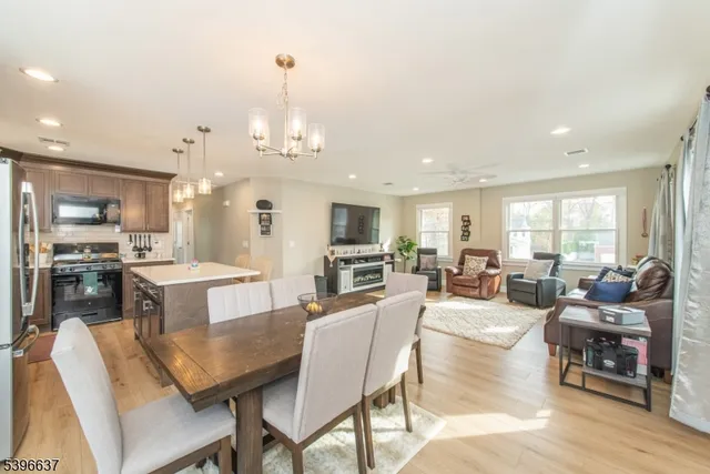 a large kitchen with a table and chairs