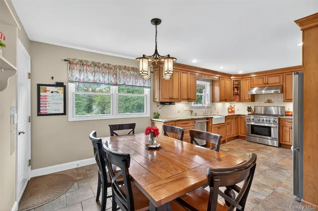 a view of a dining room with furniture window and outside view