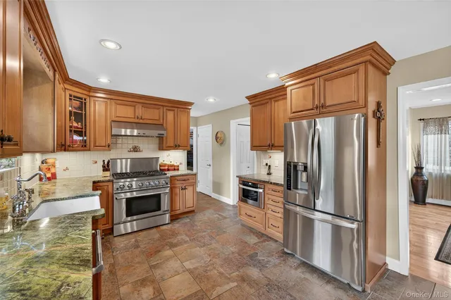 a living room with fireplace furniture and a flat screen tv