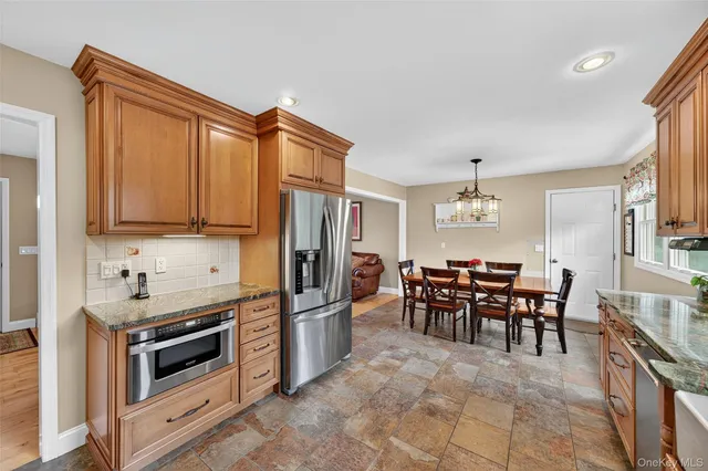 a kitchen with lots of counter top space and dining table