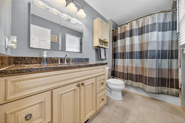 a bedroom with a bed and a bookshelf