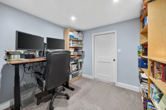 a view of a workspace with furniture