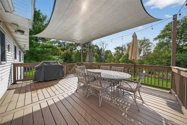 a view of a chairs on the roof deck