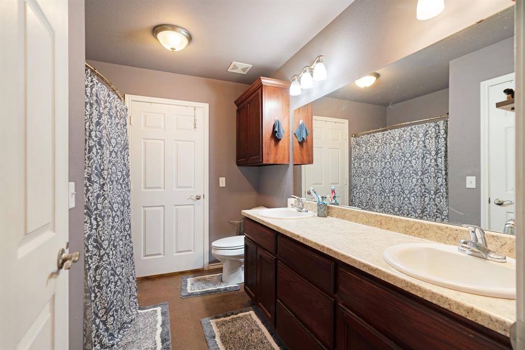 1890 County Road Sumner, TX 75486 - Photo 9 of 20 a bathroom with a sink and a mirror