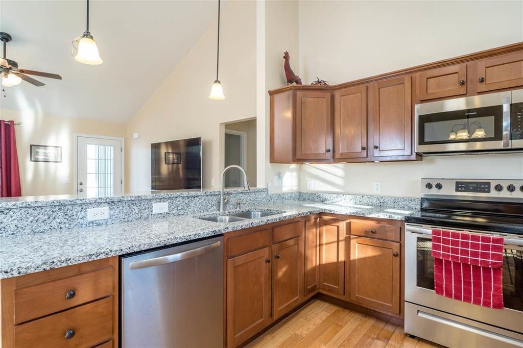 17480 Mt Pleasant Road Elkton, VA 22827 - Photo 5 of 14 a kitchen with stainless steel appliances granite countertop a sink stove and microwave