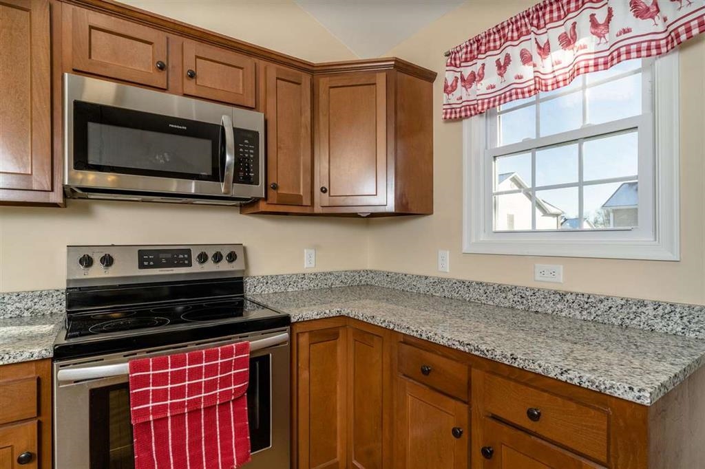 17480 Mt Pleasant Road Elkton, VA 22827 - Photo 6 of 14 a kitchen with stainless steel appliances granite countertop a sink and a microwave