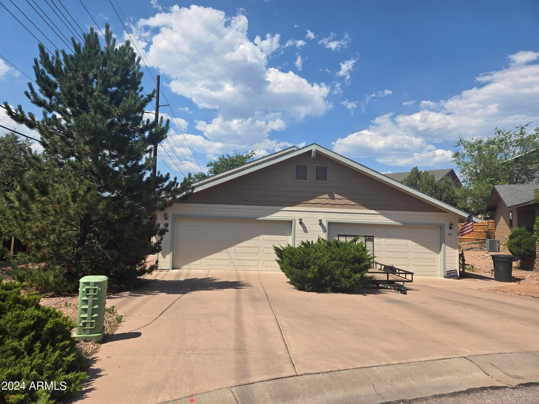 315 South Golden Bear Point Payson, AZ 85541 - Photo 1 of 29 a front view of a house with a yard and garage