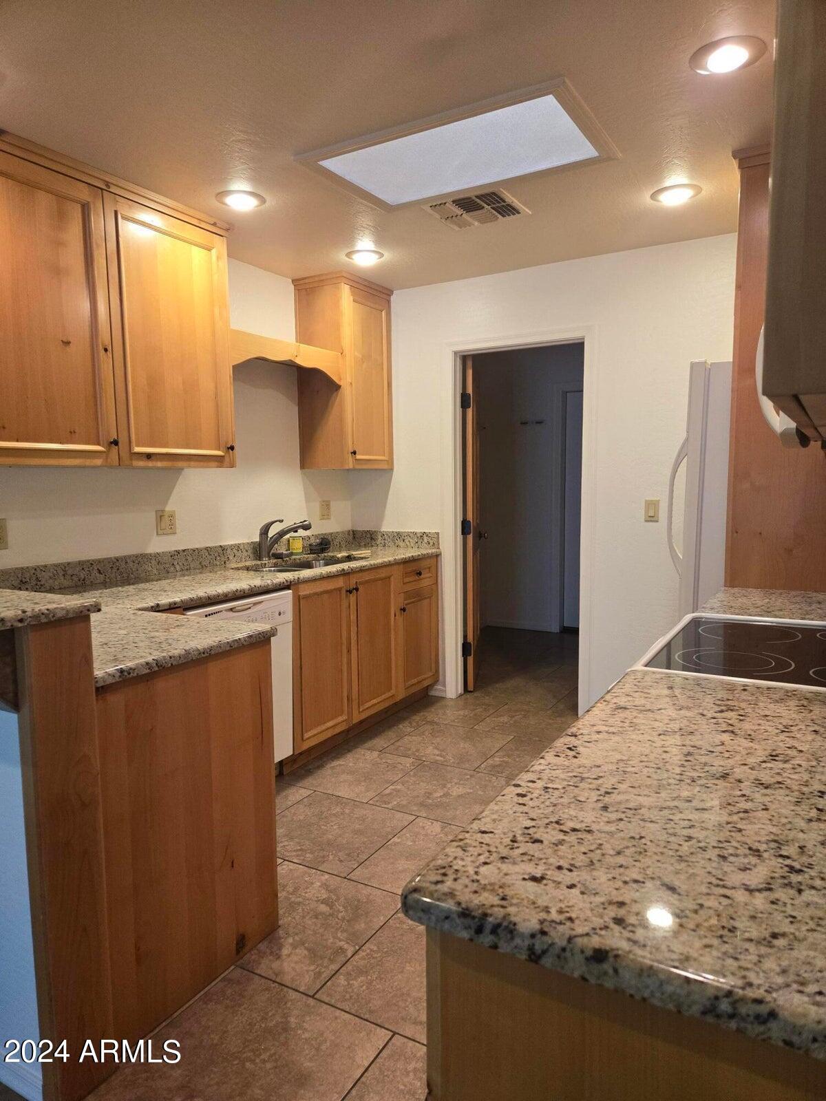 315 South Golden Bear Point Payson, AZ 85541 - Photo 13 of 29 a kitchen with stainless steel appliances granite countertop a sink stove and cabinets