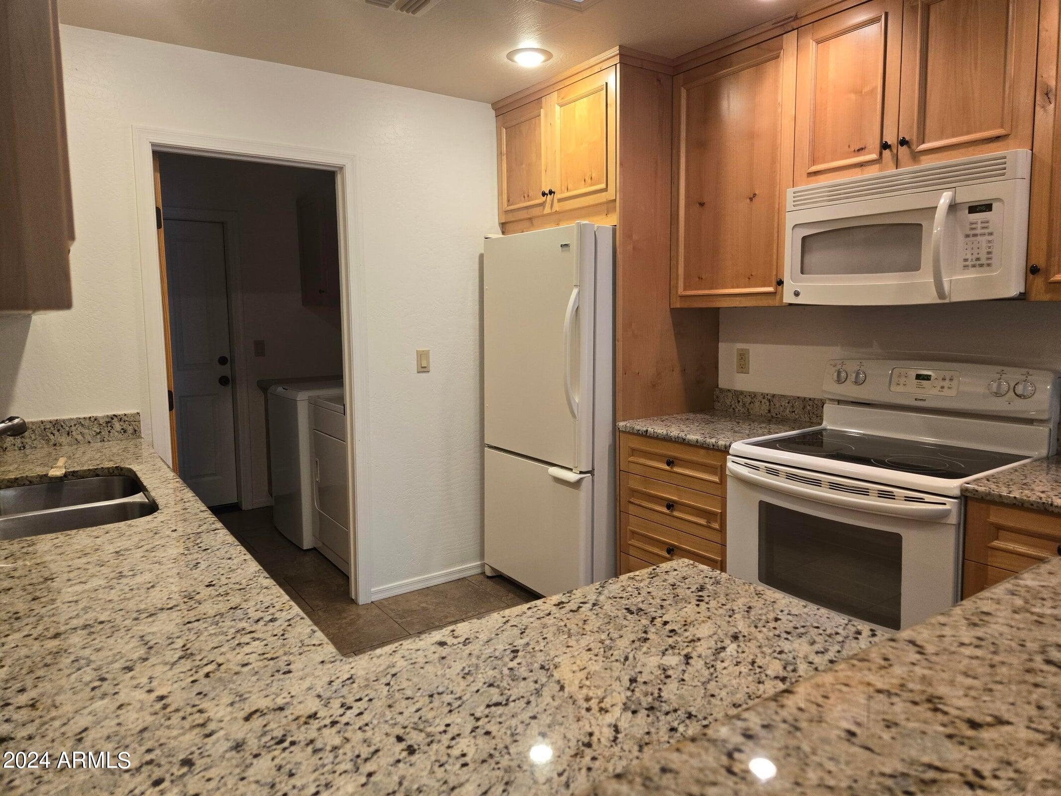 315 South Golden Bear Point Payson, AZ 85541 - Photo 14 of 29 a kitchen with a refrigerator stove and sink