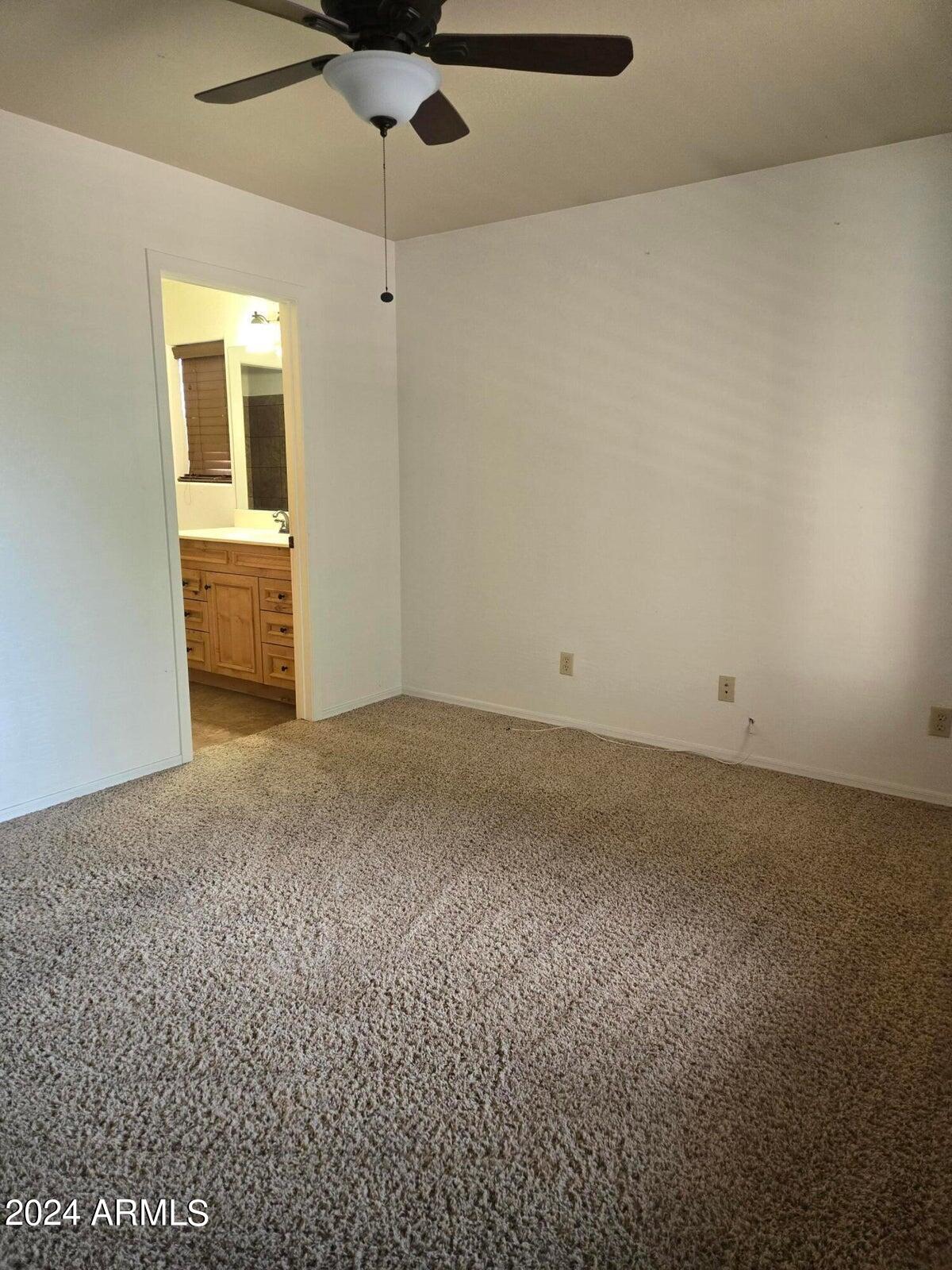 315 South Golden Bear Point Payson, AZ 85541 - Photo 16 of 29 en empty room with windows and fireplace