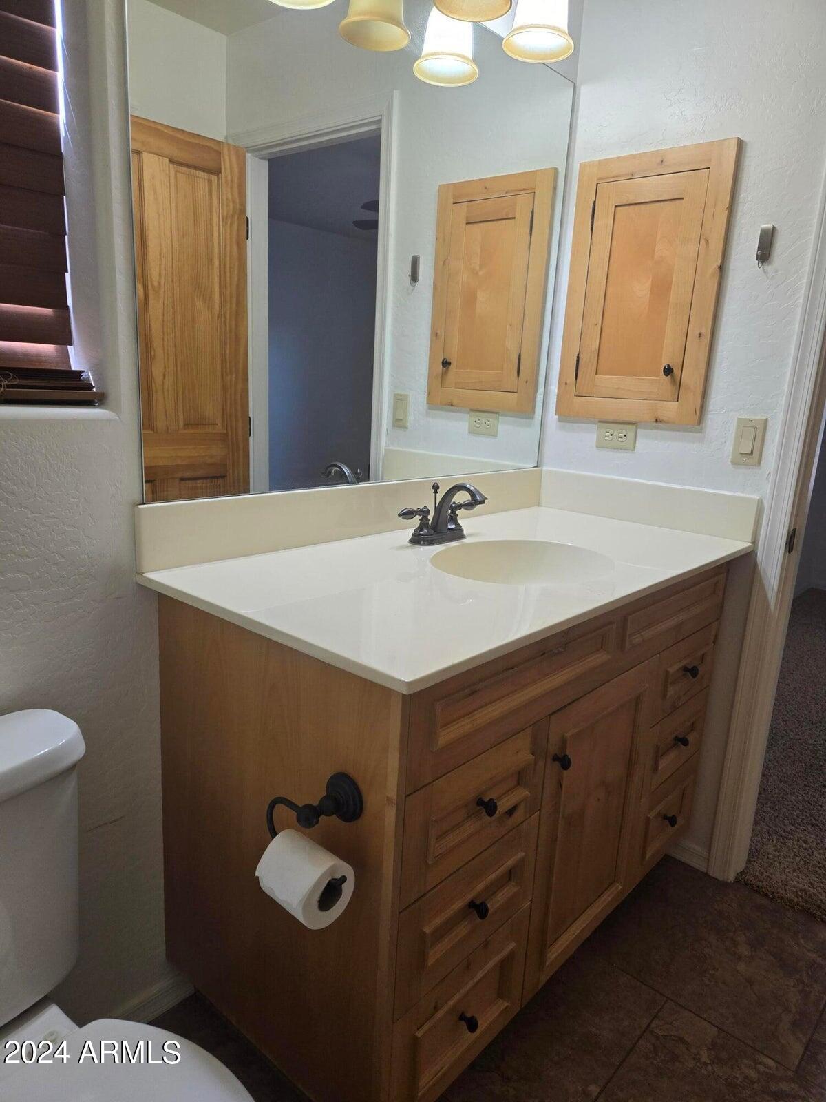 315 South Golden Bear Point Payson, AZ 85541 - Photo 18 of 29 a bathroom with a sink toilet and mirror