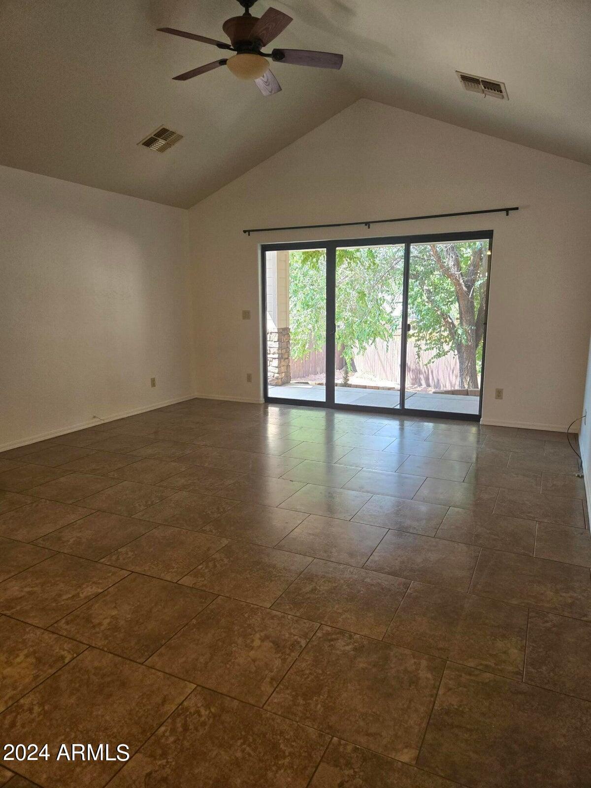 315 South Golden Bear Point Payson, AZ 85541 - Photo 10 of 29 an empty room with wooden floor fan and windows