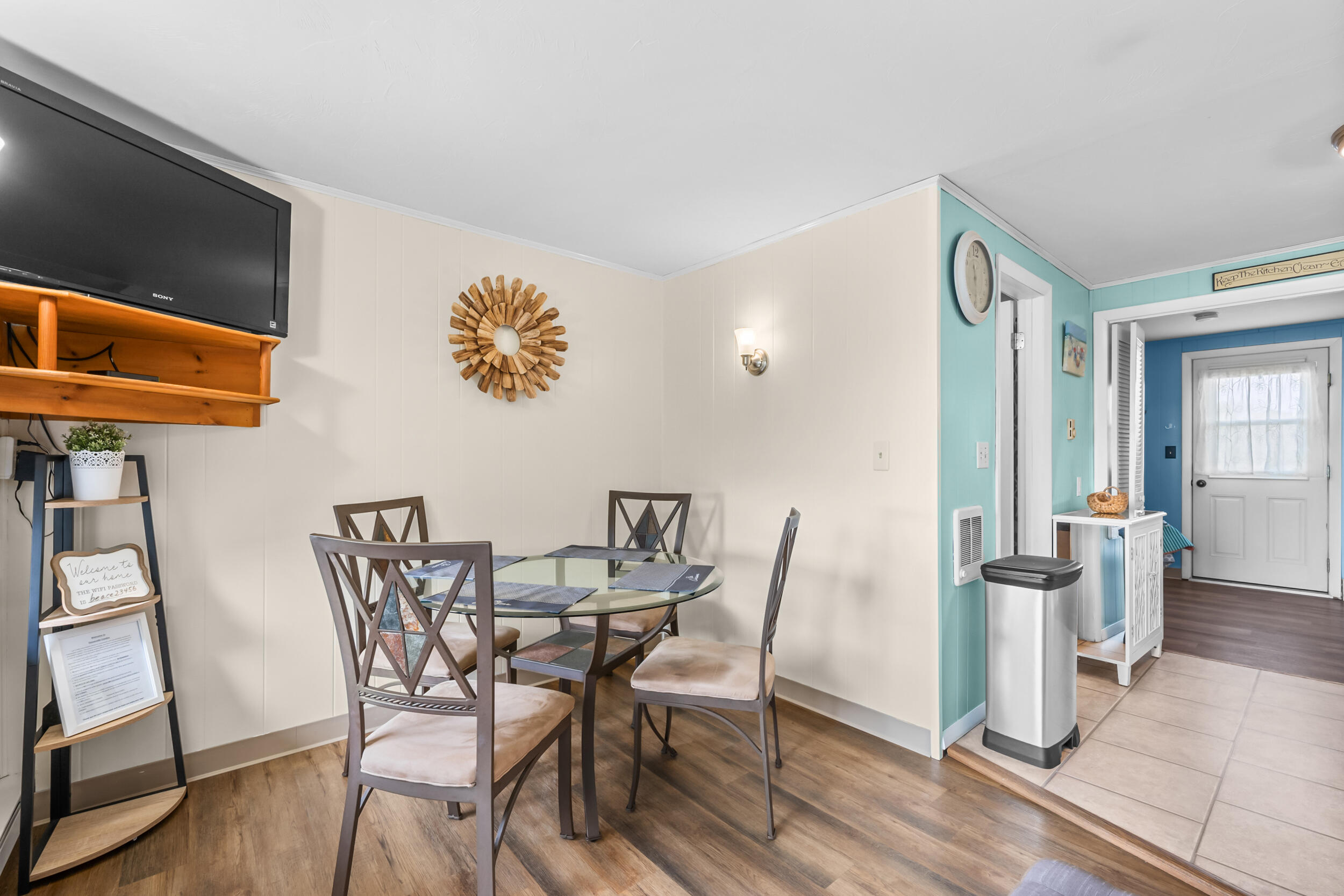 154 Old Wharf Road, Unit 36 Dennis Port, MA 02639 - Photo 12 of 28 a view of a dining room with furniture and wooden floor