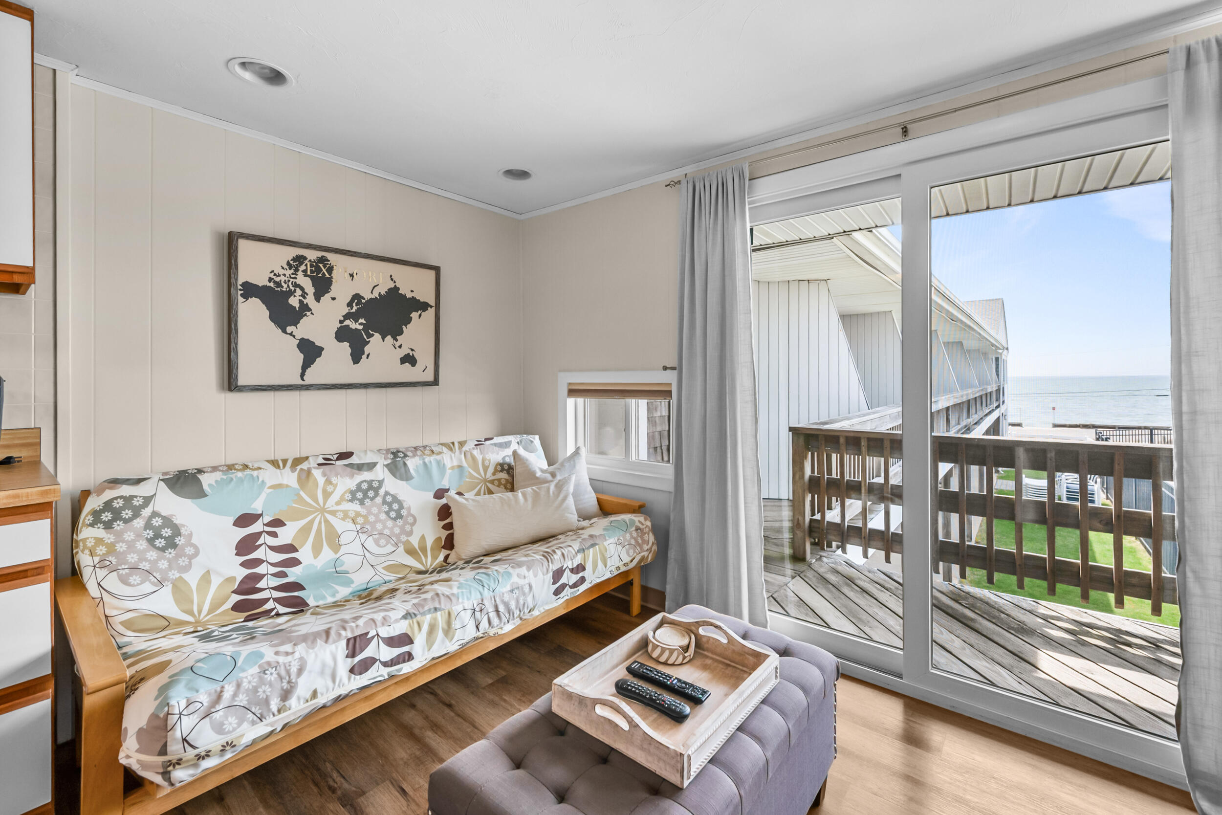 154 Old Wharf Road, Unit 36 Dennis Port, MA 02639 - Photo 14 of 28 a living room with furniture and a floor to ceiling window
