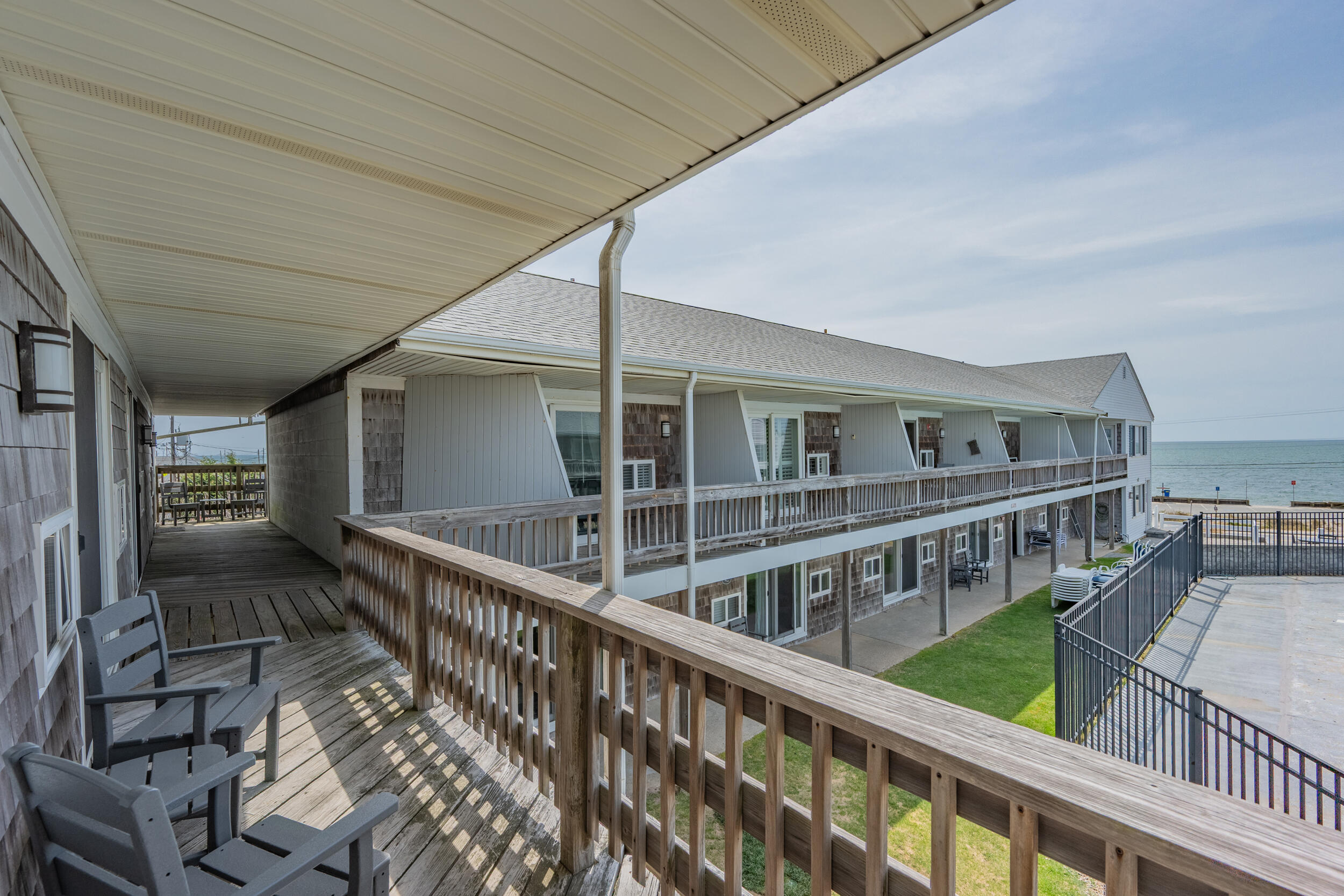 154 Old Wharf Road, Unit 36 Dennis Port, MA 02639 - Photo 19 of 28 a view of an chairs and deck in the balcony