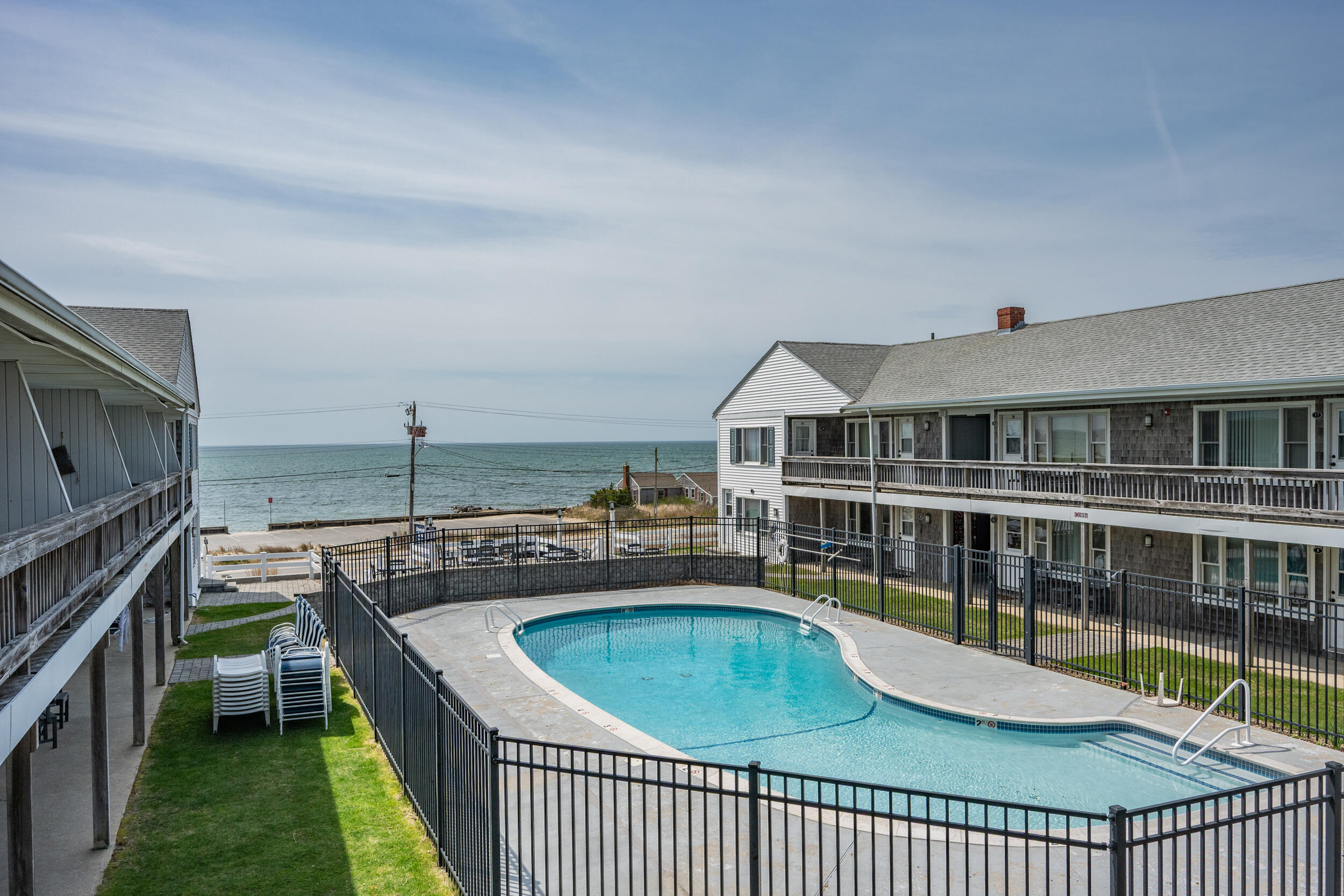 154 Old Wharf Road, Unit 36 Dennis Port, MA 02639 - Photo 20 of 28 a view of a house with a swimming pool
