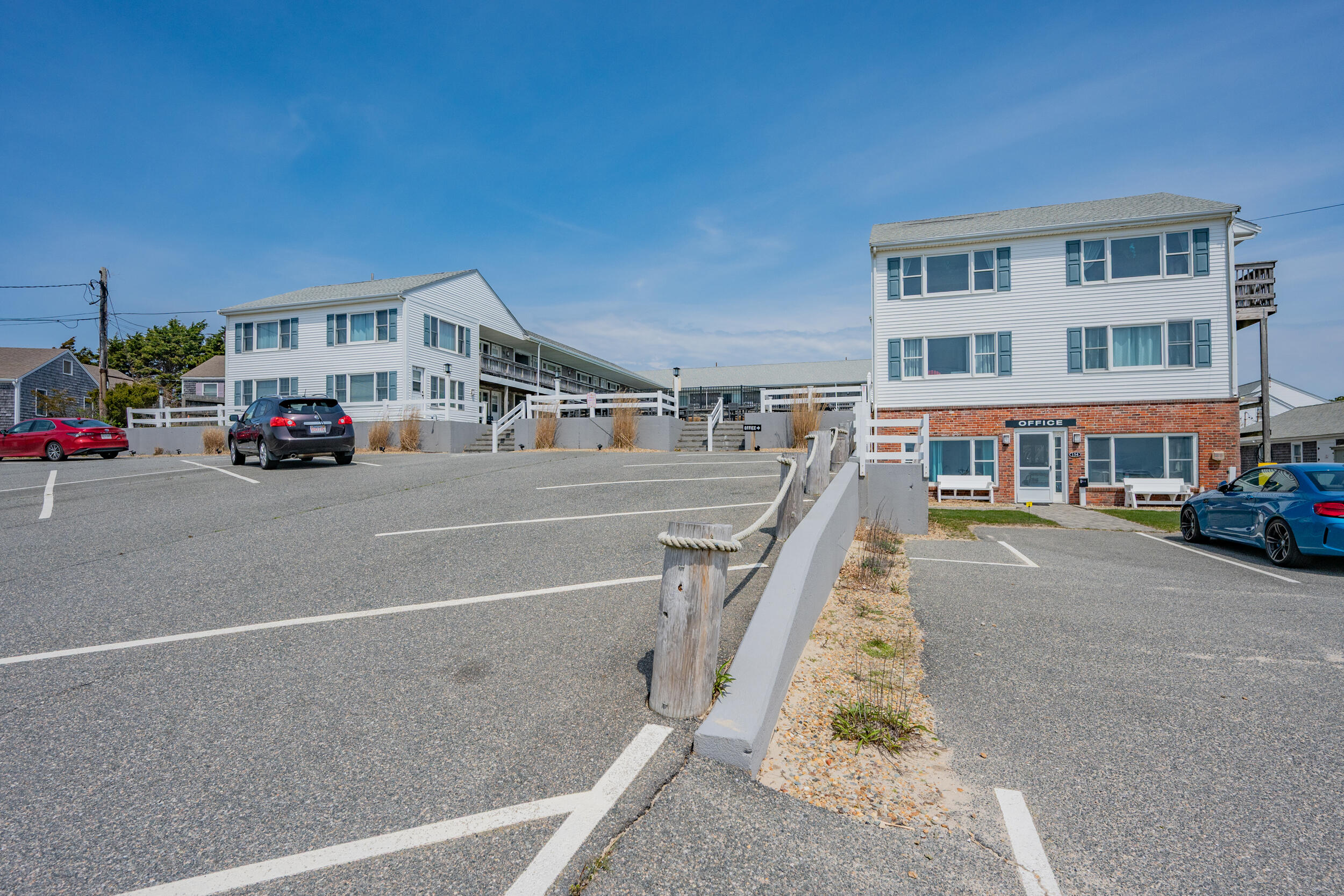 154 Old Wharf Road, Unit 36 Dennis Port, MA 02639 - Photo 2 of 28 a view of a car park in front of a building
