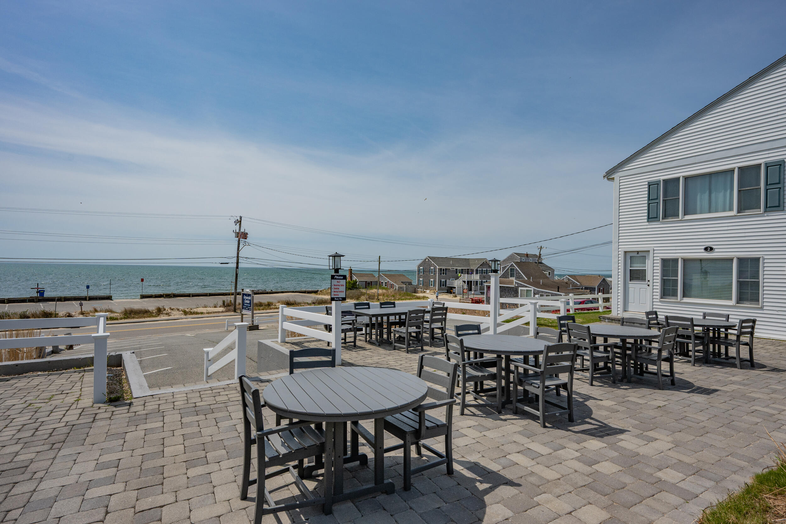 154 Old Wharf Road, Unit 36 Dennis Port, MA 02639 - Photo 22 of 28 a terrace with outdoor seating and city view