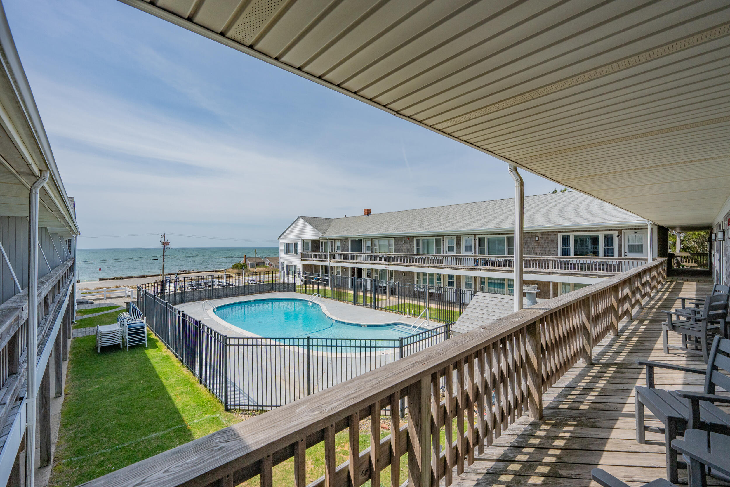 154 Old Wharf Road, Unit 36 Dennis Port, MA 02639 - Photo 3 of 28 a view of a balcony with two chairs