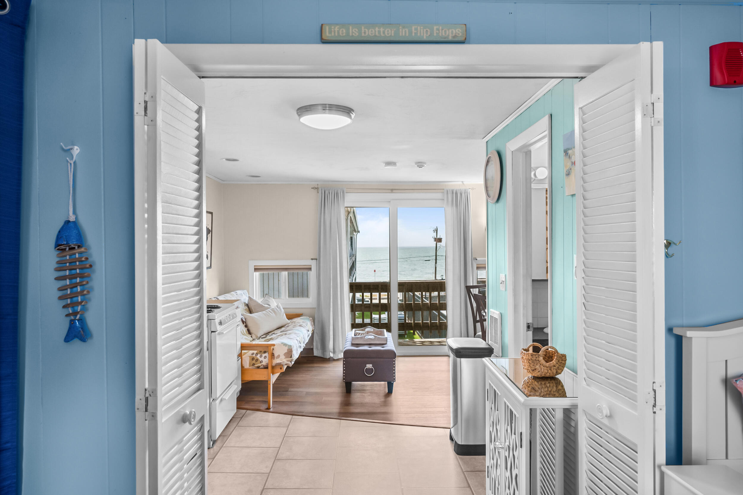 154 Old Wharf Road, Unit 36 Dennis Port, MA 02639 - Photo 6 of 28 a living room with furniture and a large window