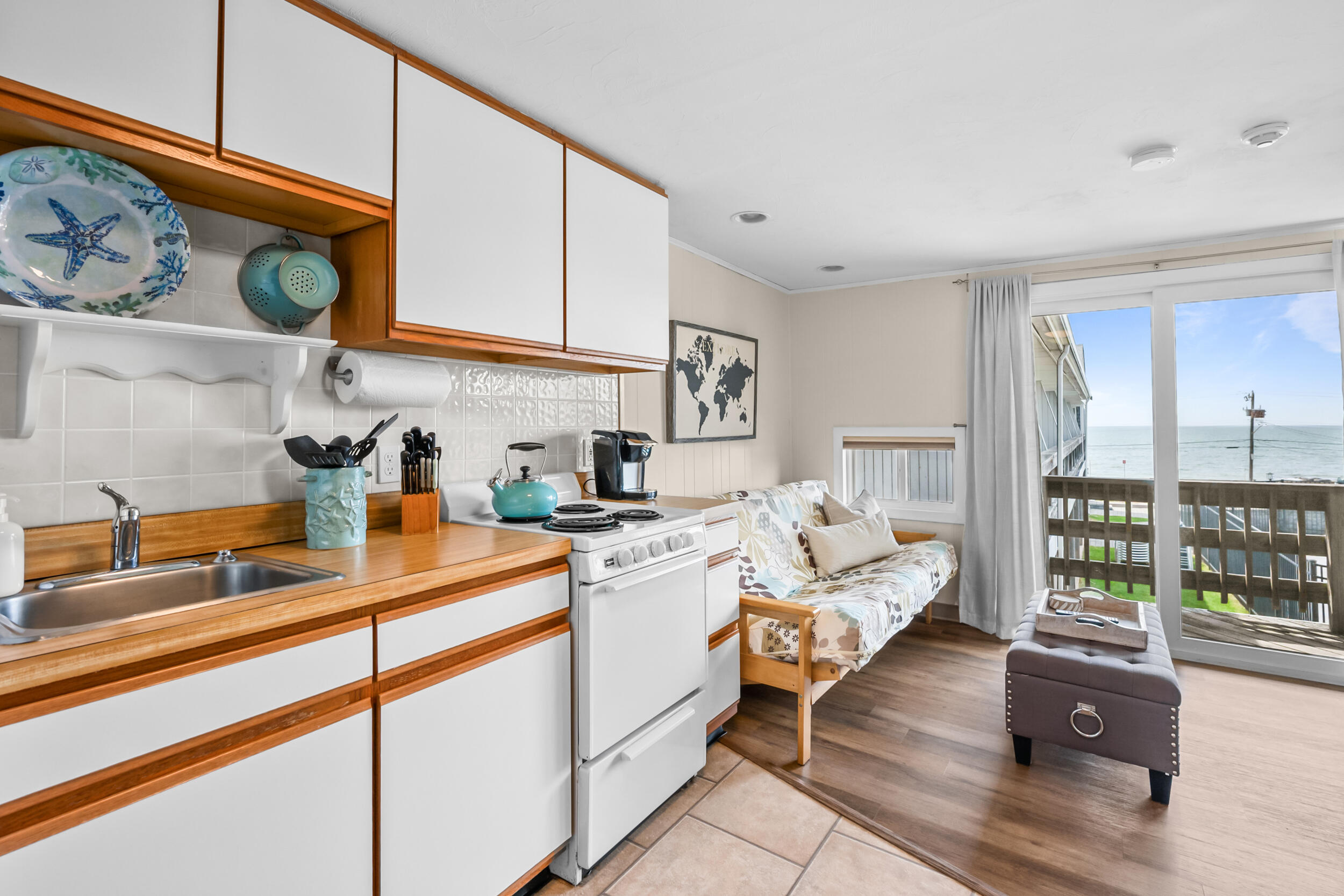 154 Old Wharf Road, Unit 36 Dennis Port, MA 02639 - Photo 7 of 28 a kitchen with stainless steel appliances granite countertop a sink and cabinets