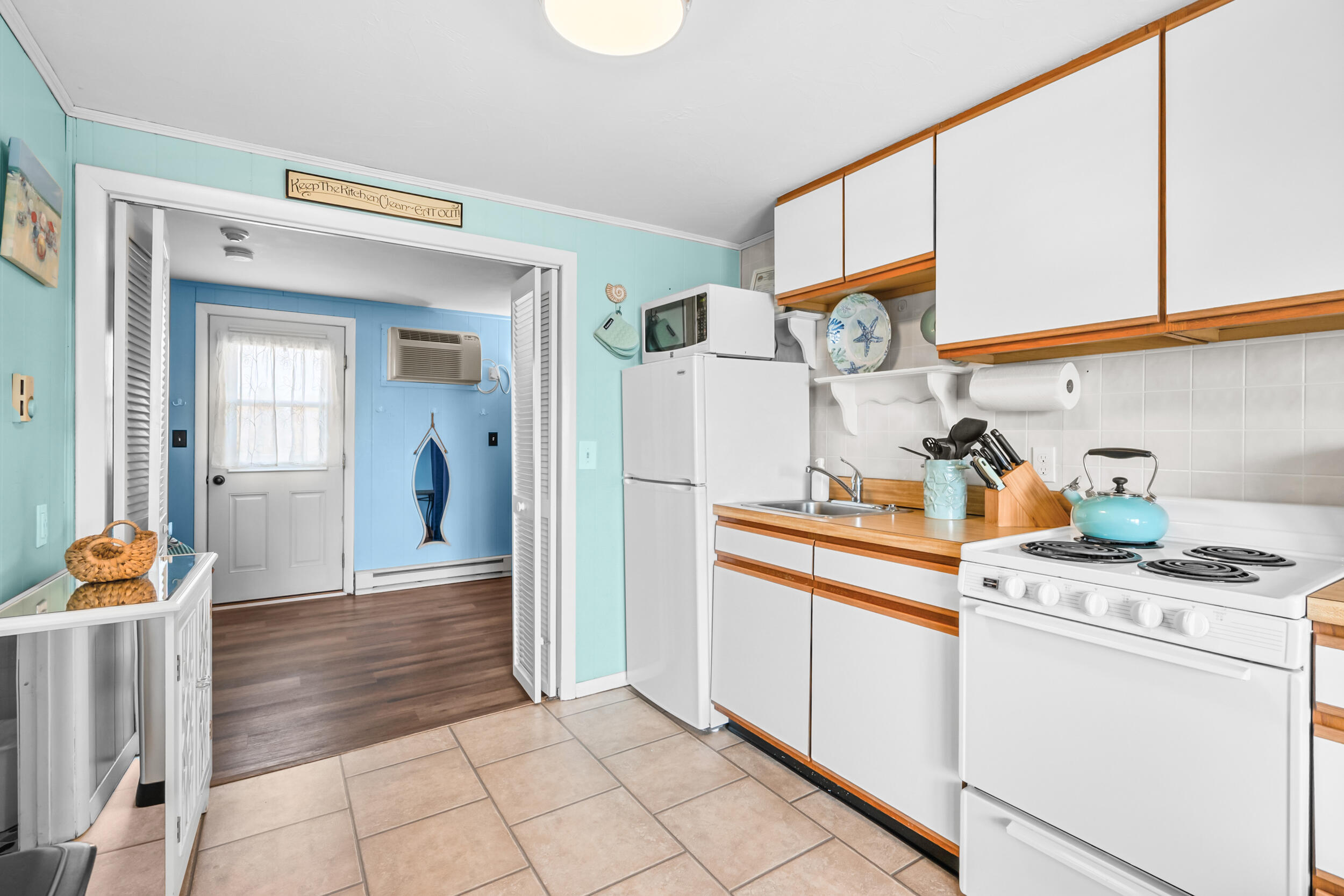 154 Old Wharf Road, Unit 36 Dennis Port, MA 02639 - Photo 8 of 28 a kitchen with stainless steel appliances granite countertop a refrigerator and a stove