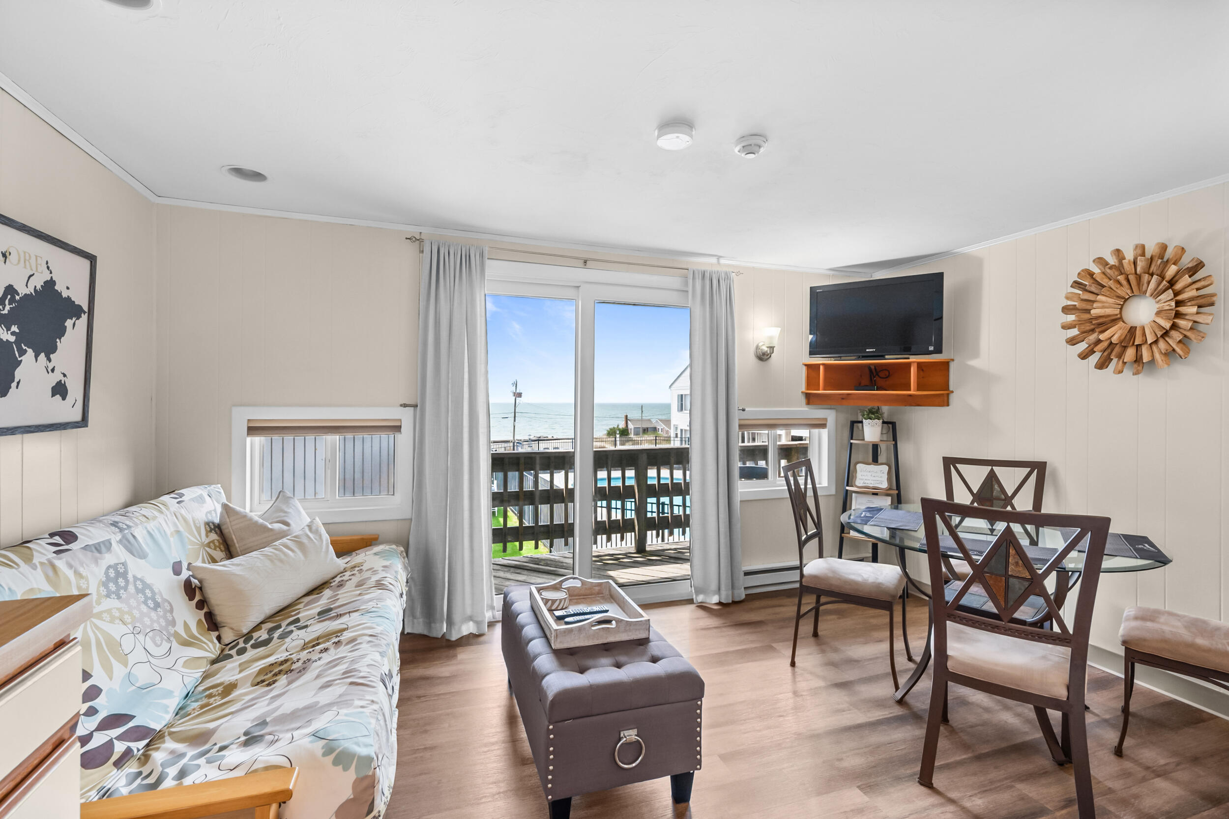 154 Old Wharf Road, Unit 36 Dennis Port, MA 02639 - Photo 9 of 28 a living room with furniture and a flat screen tv