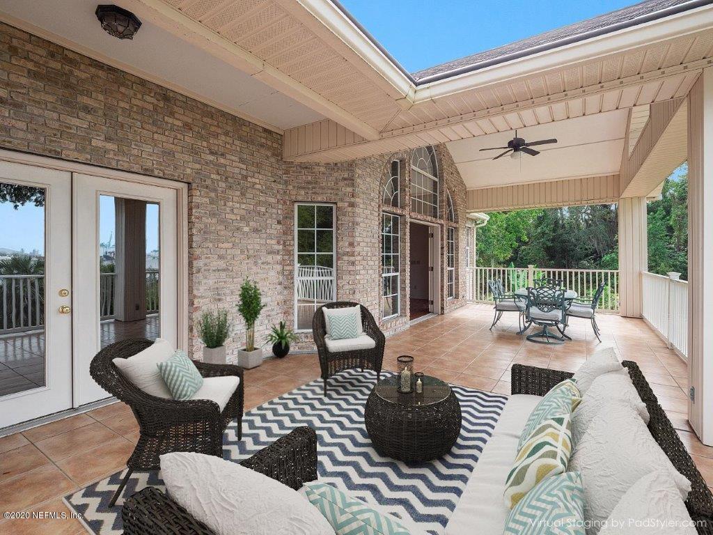 3664 Spinnaker Court Jacksonville, FL 32277 - Photo 12 of 42 a outdoor space with patio couches and a potted plant