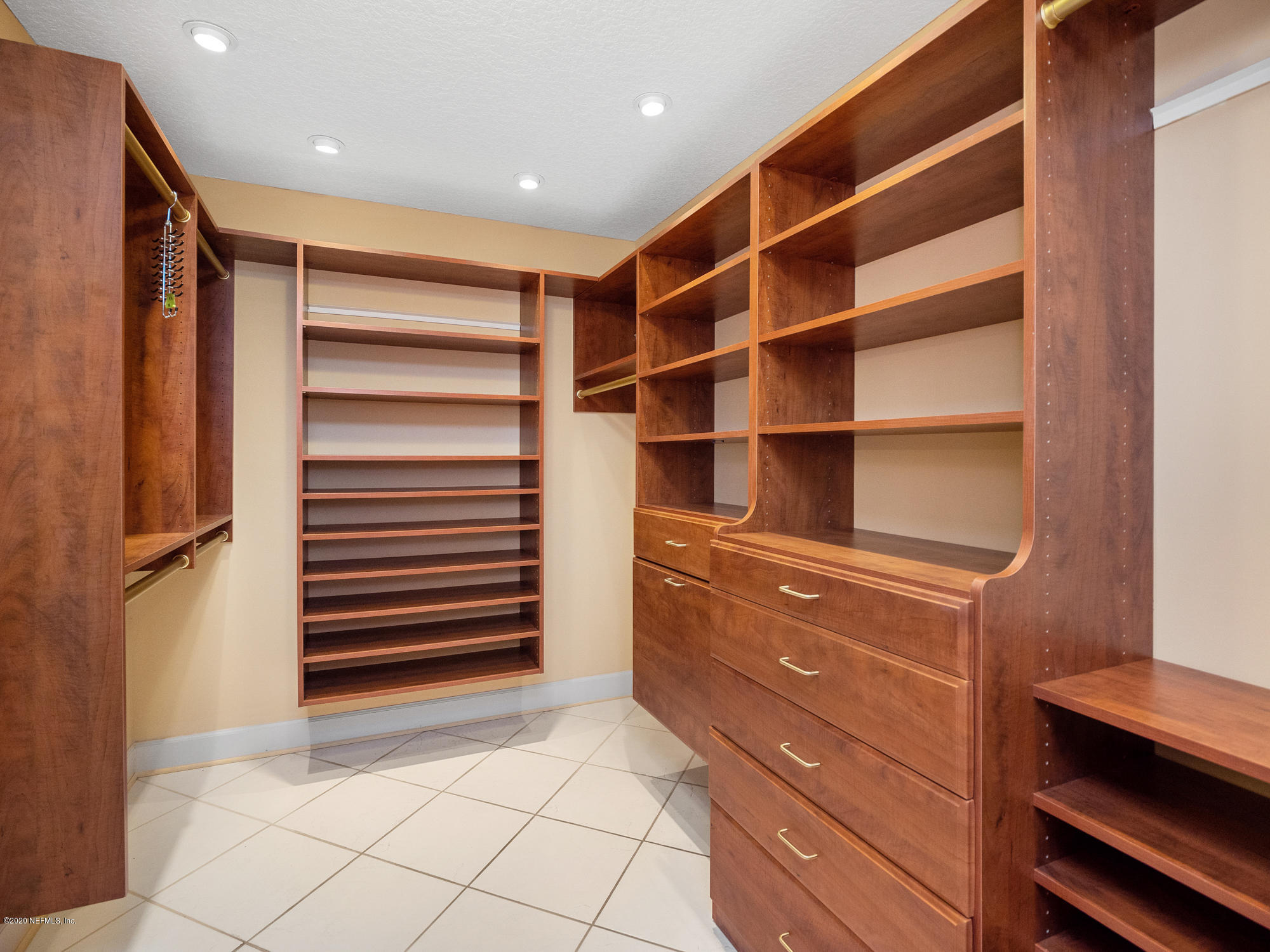 3664 Spinnaker Court Jacksonville, FL 32277 - Photo 17 of 42 a view of walk in closet with empty racks