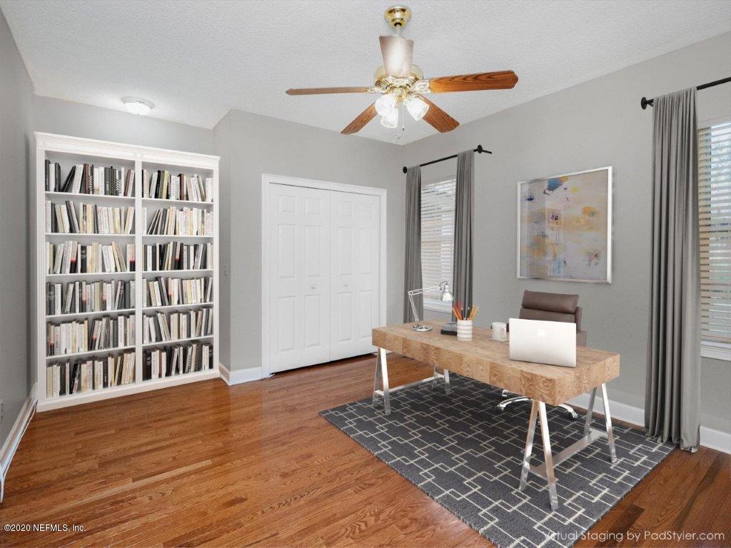 3664 Spinnaker Court Jacksonville, FL 32277 - Photo 19 of 42 a living room with furniture and a window