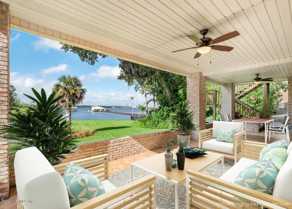 3664 Spinnaker Court Jacksonville, FL 32277 - Photo 28 of 42 a view of a patio with couches and potted plants