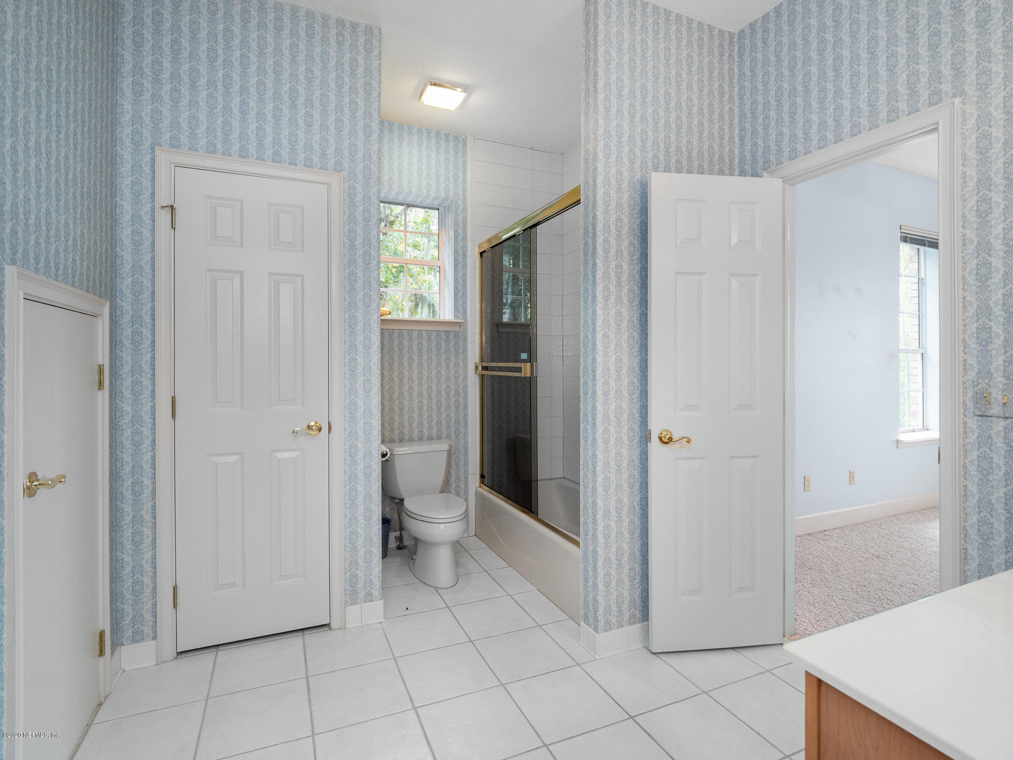 3664 Spinnaker Court Jacksonville, FL 32277 - Photo 33 of 42 a bathroom with a toilet sink and shower