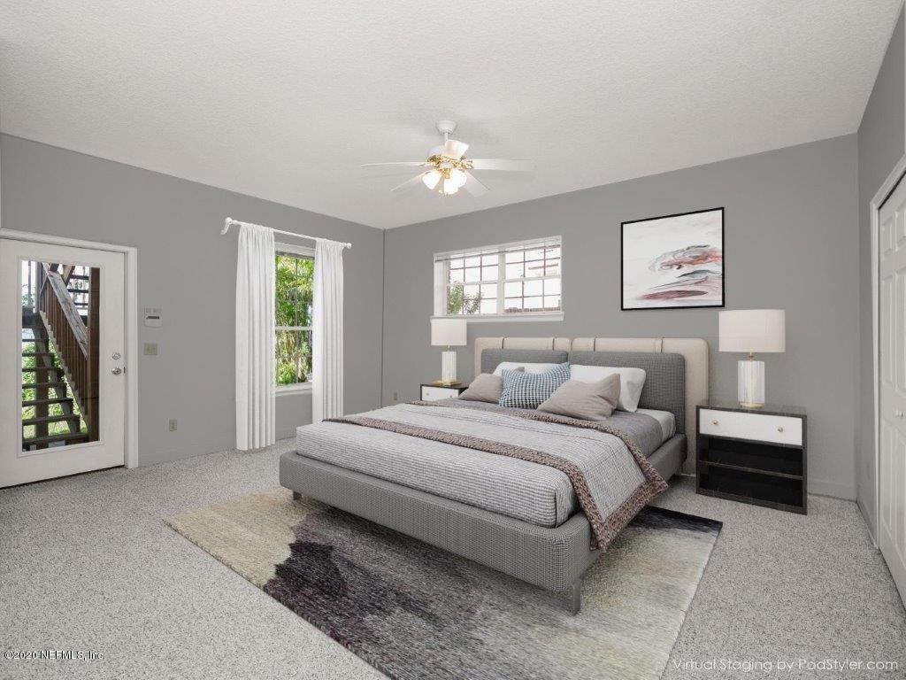 3664 Spinnaker Court Jacksonville, FL 32277 - Photo 35 of 42 a bedroom with a bed painting on wall and two windows