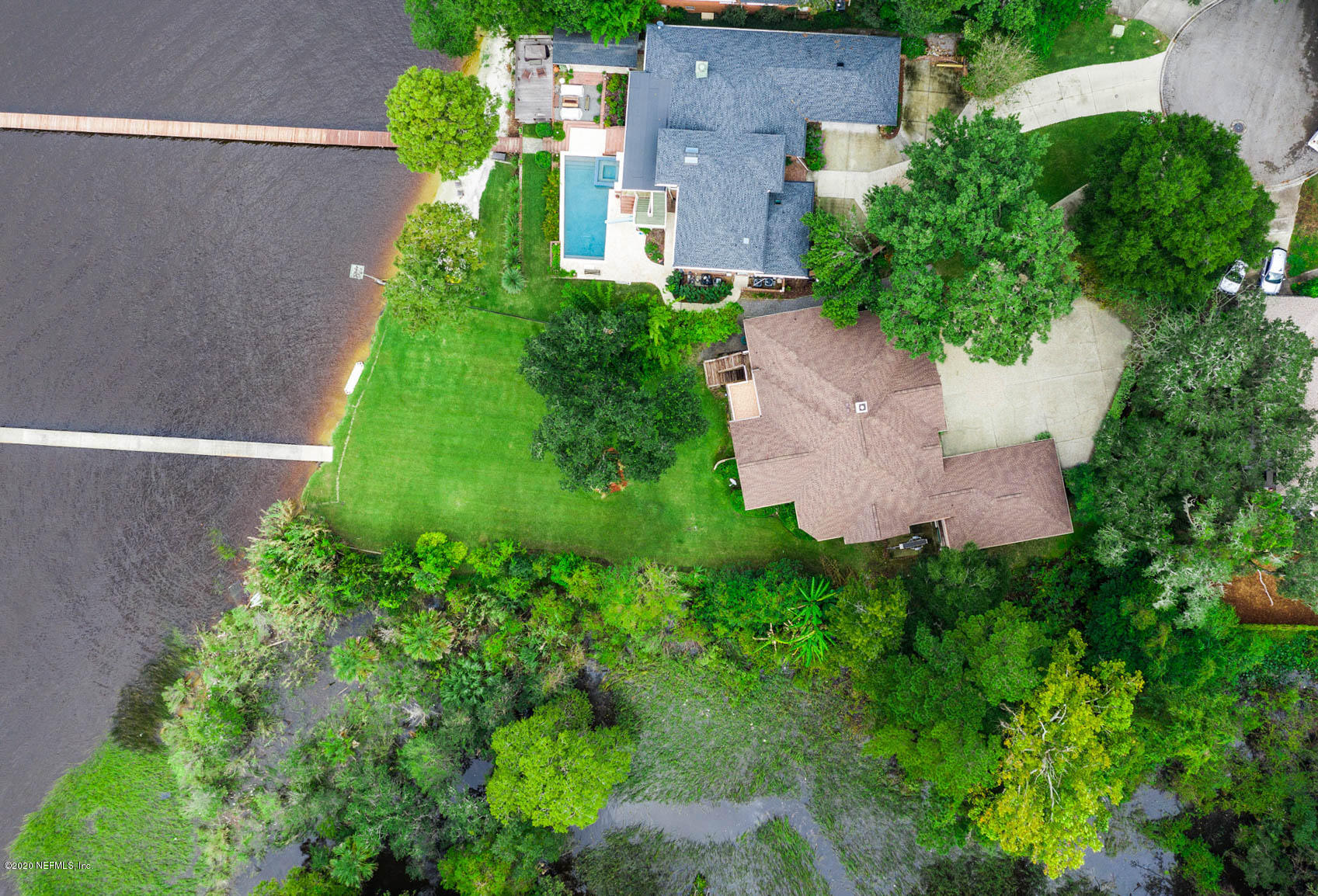 3664 Spinnaker Court Jacksonville, FL 32277 - Photo 39 of 42 an aerial view of a house with a yard and garden