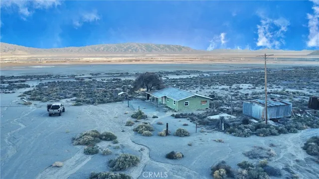 a view of an ocean beach and mountain