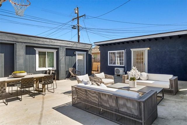 a kitchen with stainless steel appliances granite countertop a refrigerator a sink a stove a microwave and island