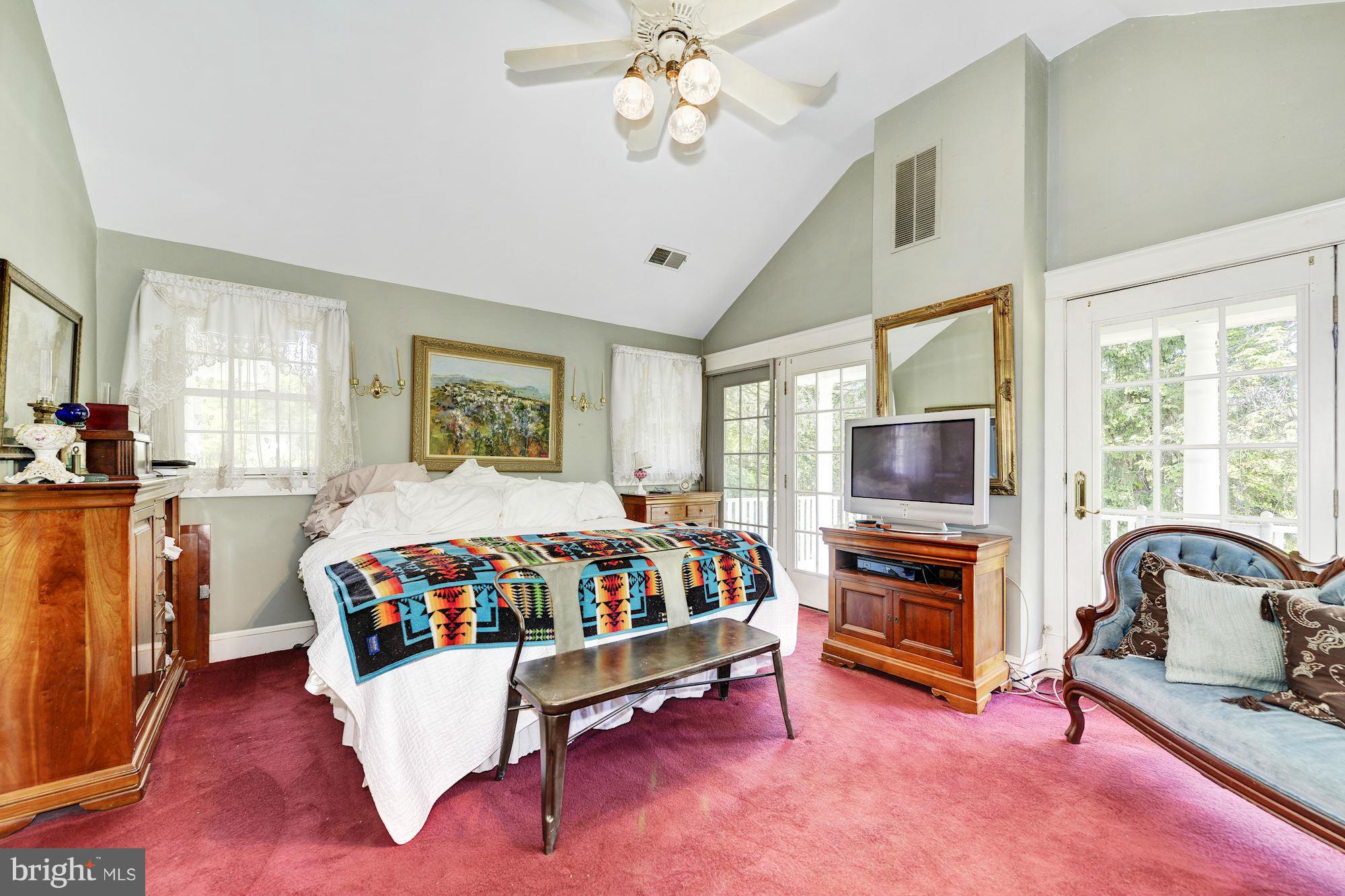 4011 Gallows Road Annandale, VA 22003 - Photo 13 of 27 a bed room with furniture and a flat screen tv