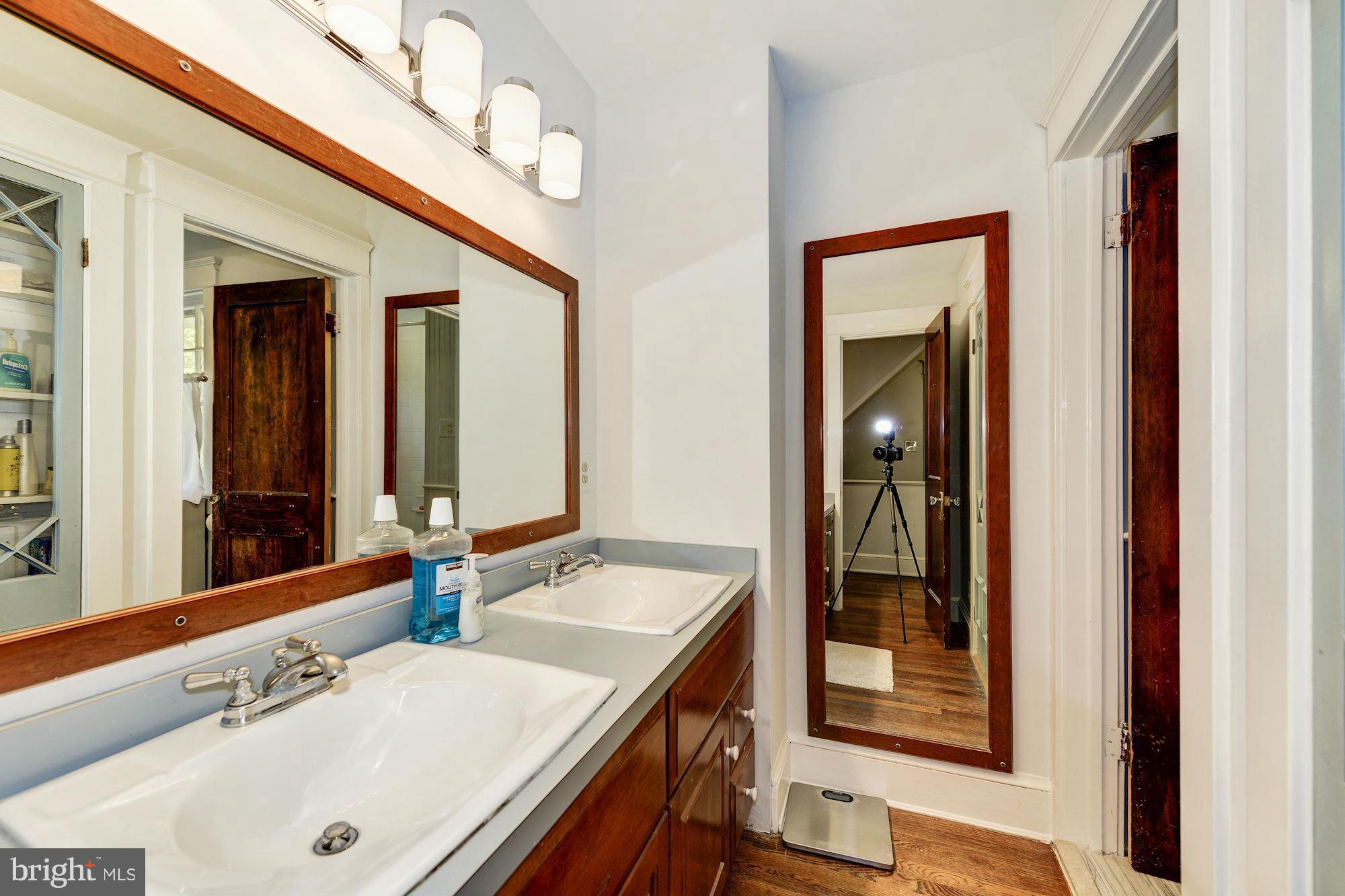 4011 Gallows Road Annandale, VA 22003 - Photo 19 of 27 a bathroom with a tub a sink and a mirror