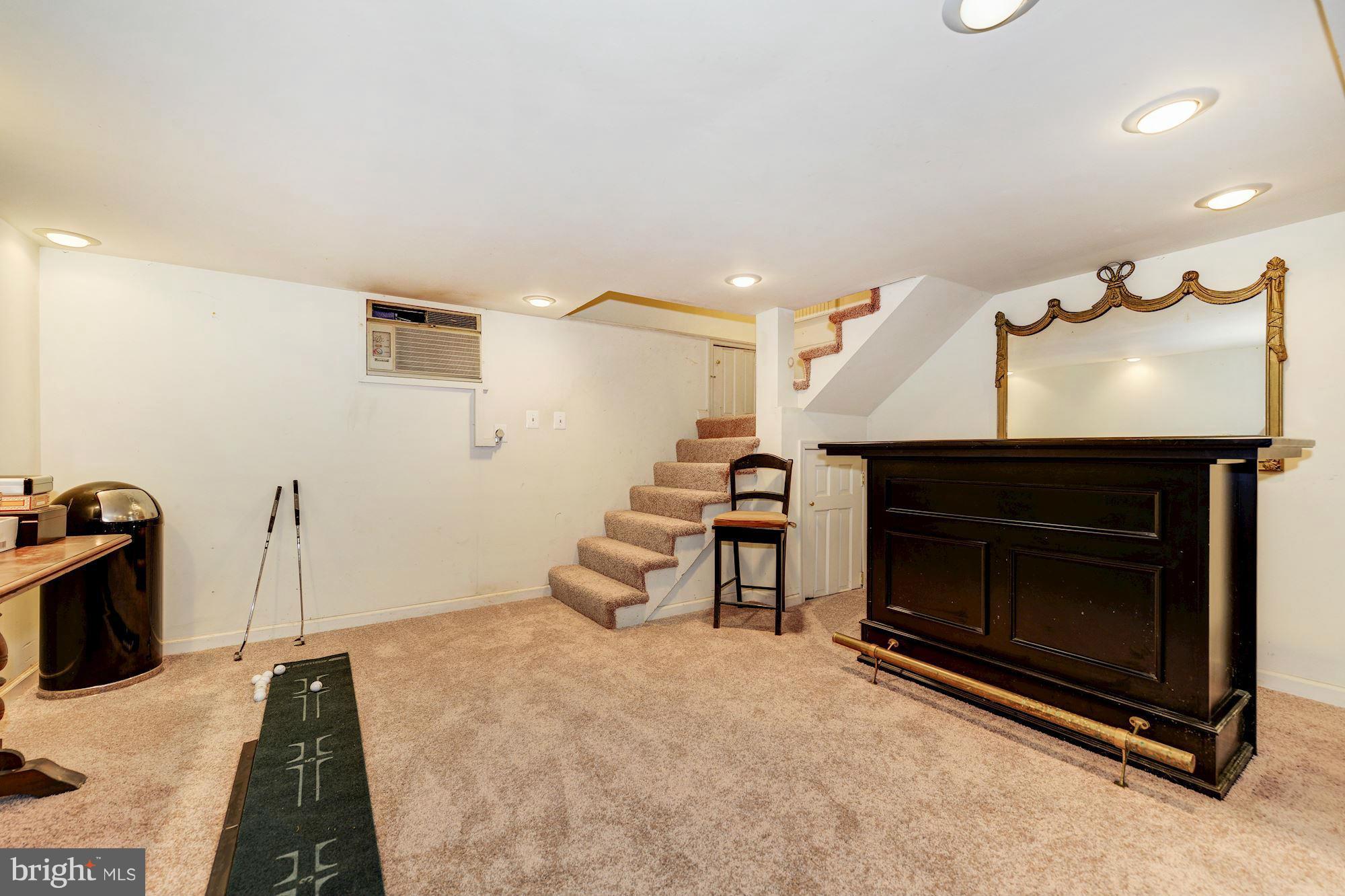 4011 Gallows Road Annandale, VA 22003 - Photo 20 of 27 a bed room with a bed and a fireplace