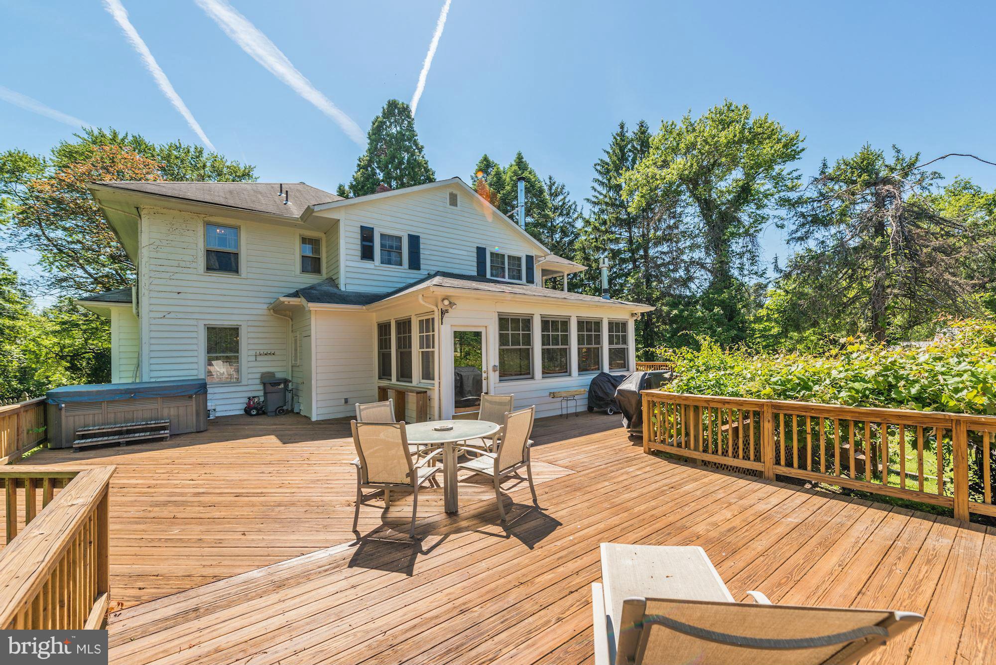 4011 Gallows Road Annandale, VA 22003 - Photo 21 of 27 a view of a house with wooden deck and furniture