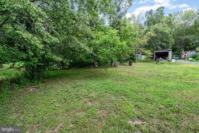 a view of outdoor space with deck and yard
